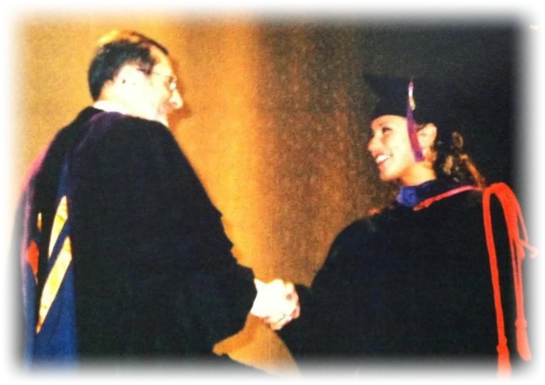 Sarah N. Dimmich shaking hands with Dean Norman Lefstein at her 2002 law school commencement
